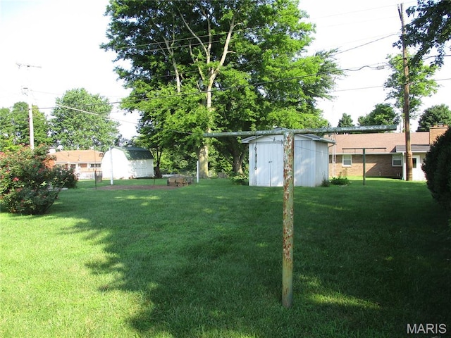 103 Paulette St, Chester, IL 62233 - view of green lawn featuring a storage unit