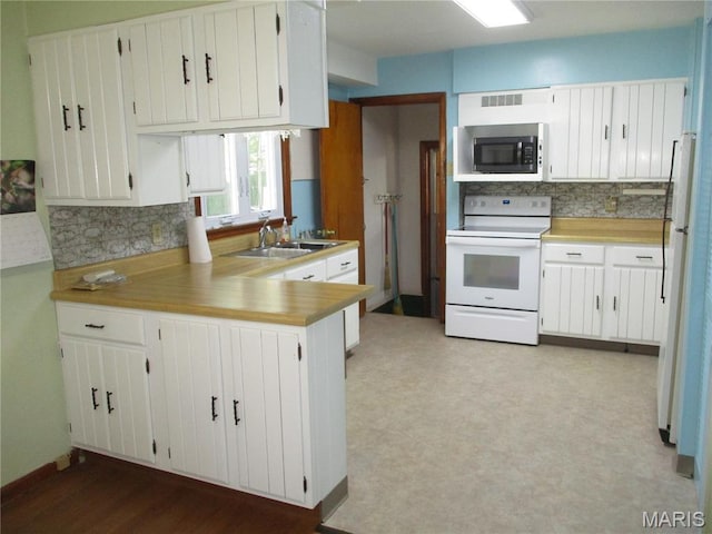 103 Paulette St, Chester, IL 62233 - kitchen with white appliances, a peninsula, tasteful backsplash, and white cabinets