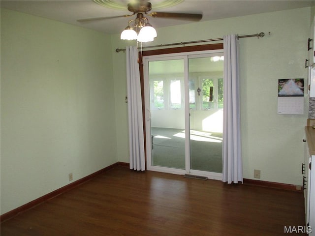 103 Paulette St, Chester, IL 62233 - empty room featuring dark wood-style flooring and ceiling fan