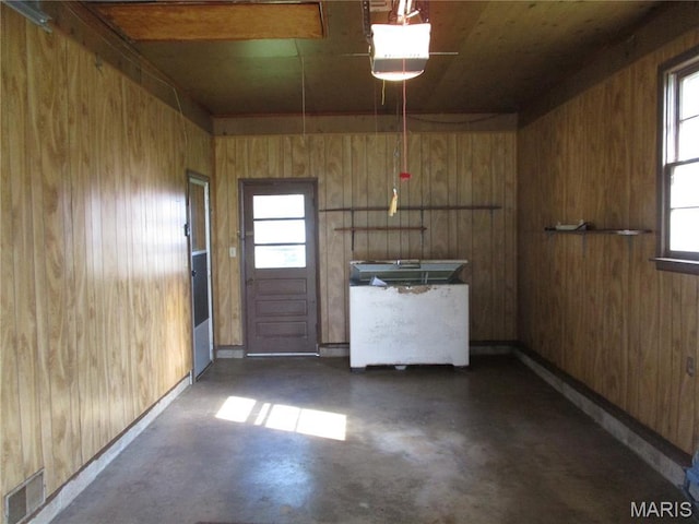 103 Paulette St, Chester, IL 62233 - interior space with concrete flooring, wooden walls, and brown cabinets