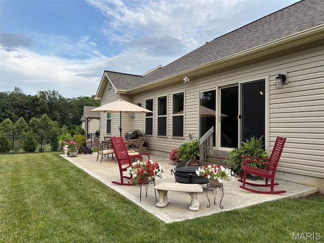 1032 Timber Bluff Dr, Wentzville, MO 63385 - rear view of house featuring a patio, a fire pit, and a shingled roof