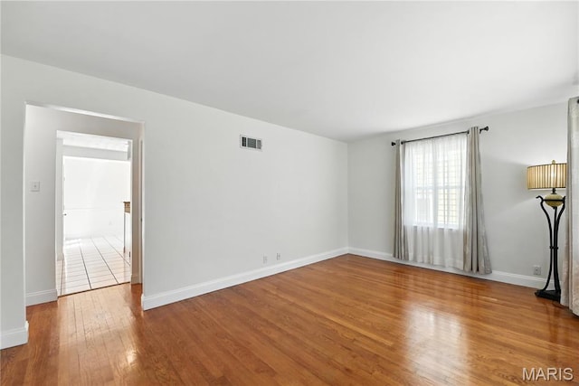 429 Belvedere Ln, Glendale, MO 63122 - unfurnished room featuring wood finished floors and baseboards