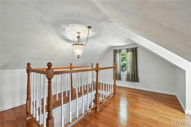 429 Belvedere Ln, Glendale, MO 63122 - additional living space featuring wood finished floors and vaulted ceiling