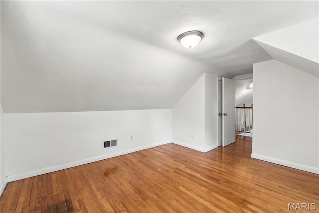 429 Belvedere Ln, Glendale, MO 63122 - bonus room featuring lofted ceiling and wood finished floors