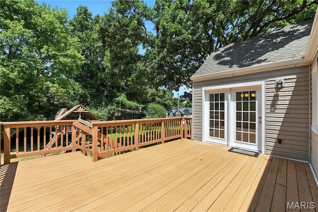 429 Belvedere Ln, Glendale, MO 63122 - deck with a playground and view of wooded area