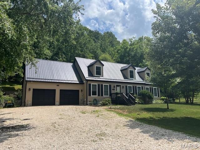 1333 Poor Farm Hollow Rd, Hardin, IL 62047 - new england style home featuring an attached garage, driveway, a front yard, and a metal roof