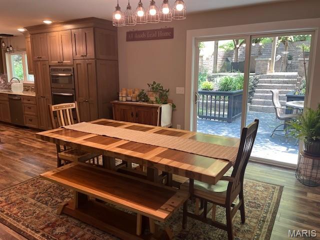 1333 Poor Farm Hollow Rd, Hardin, IL 62047 - dining area featuring a chandelier and dark wood-style flooring