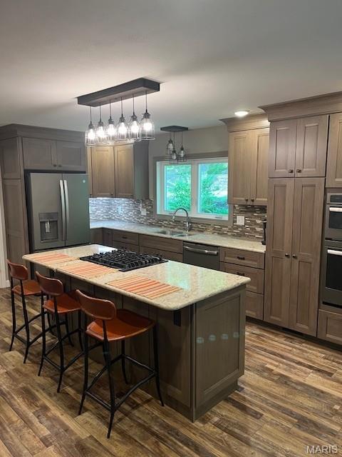 1333 Poor Farm Hollow Rd, Hardin, IL 62047 - kitchen with stainless steel appliances, dark wood-style floors, decorative backsplash, and a center island