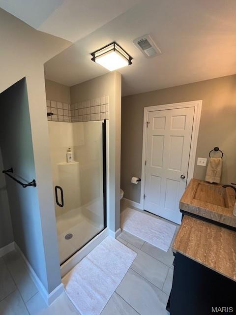 1333 Poor Farm Hollow Rd, Hardin, IL 62047 - bathroom featuring a shower stall, vanity, and tile patterned flooring