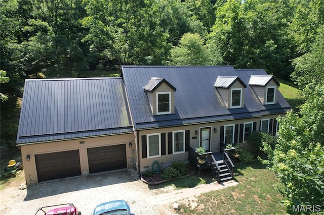 1333 Poor Farm Hollow Rd, Hardin, IL 62047 - new england style home featuring a metal roof, an attached garage, gravel driveway, and a wooded view