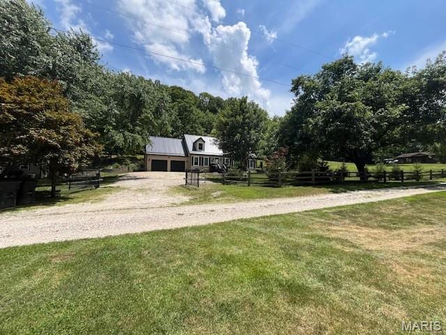 1333 Poor Farm Hollow Rd, Hardin, IL 62047 - view of front of house with dirt driveway and a garage