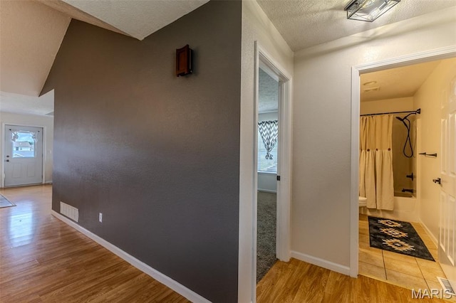 143 Lyle Curtis Cir, Waynesville, MO 65583 - corridor featuring wood finished floors and a textured ceiling