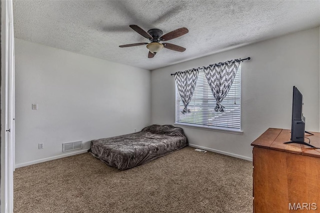 143 Lyle Curtis Cir, Waynesville, MO 65583 - carpeted bedroom featuring a textured ceiling and a ceiling fan