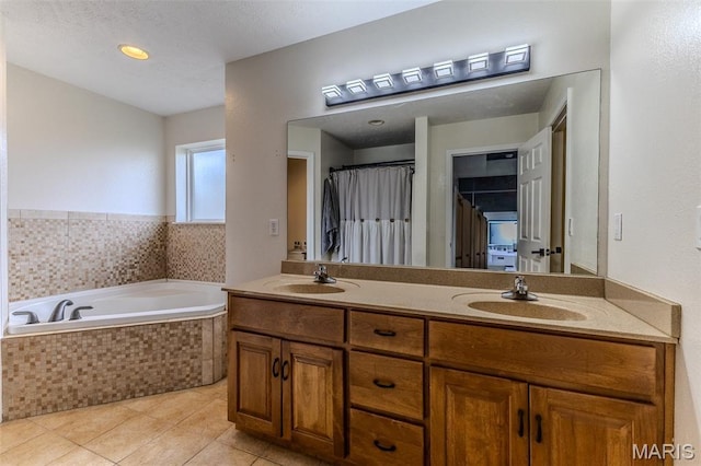 143 Lyle Curtis Cir, Waynesville, MO 65583 - full bath with double vanity, a bath, and tile patterned flooring