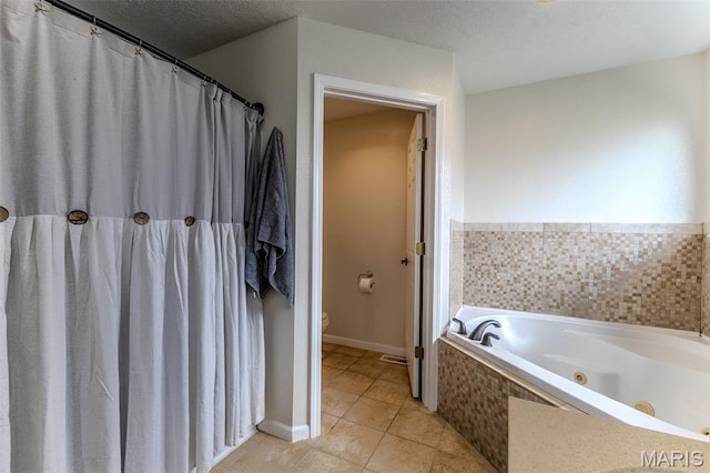 143 Lyle Curtis Cir, Waynesville, MO 65583 - full bath with tile patterned floors, a whirlpool tub, and a textured ceiling