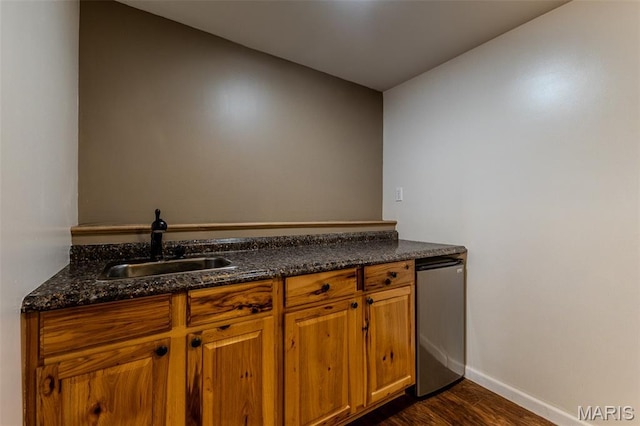 143 Lyle Curtis Cir, Waynesville, MO 65583 - kitchen with dark wood-style flooring, brown cabinets, and dark stone counters