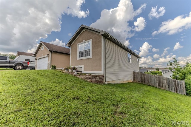 143 Lyle Curtis Cir, Waynesville, MO 65583 - view of property exterior with a garage and stucco siding