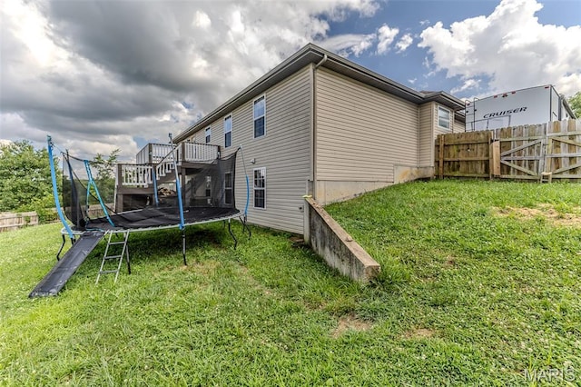 143 Lyle Curtis Cir, Waynesville, MO 65583 - view of property exterior with a trampoline and a deck