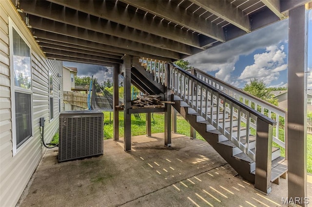 143 Lyle Curtis Cir, Waynesville, MO 65583 - view of patio / terrace with a trampoline and stairs