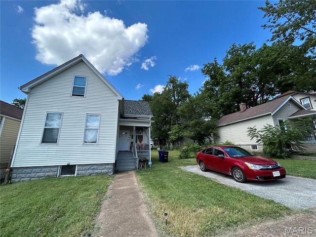 6533 Corbitt Ave, Saint Louis, MO 63130 - view of front of home featuring covered porch, a front lawn, and a shingled roof