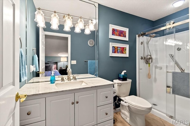 2 Tanewood Ct, Belleville, IL 62223 - bathroom with ensuite bath, a stall shower, vanity, and a textured ceiling