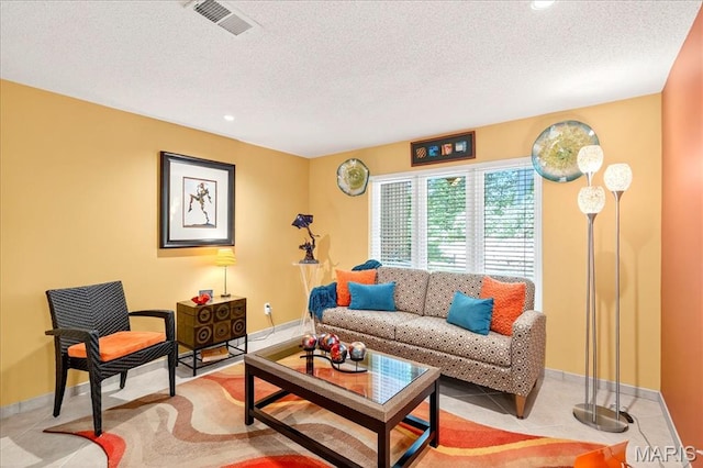 2 Tanewood Ct, Belleville, IL 62223 - tiled living room featuring a textured ceiling and recessed lighting