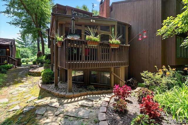 2 Tanewood Ct, Belleville, IL 62223 - rear view of house with a chimney and a wooden deck