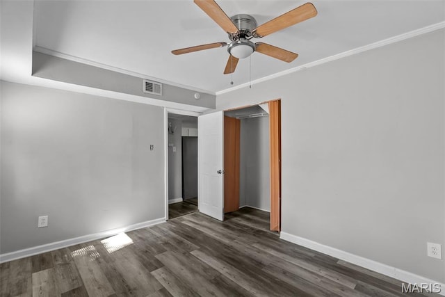 2826 Dawnview Dr, Florissant, MO 63031 - unfurnished bedroom featuring dark wood-type flooring, ornamental molding, a closet, and ceiling fan