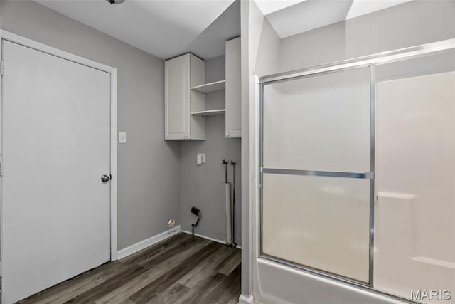 2826 Dawnview Dr, Florissant, MO 63031 - laundry area featuring cabinet space, wood finished floors, and hookup for a washing machine