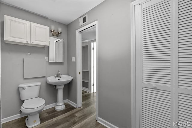 2826 Dawnview Dr, Florissant, MO 63031 - half bath featuring wood finished floors and a closet