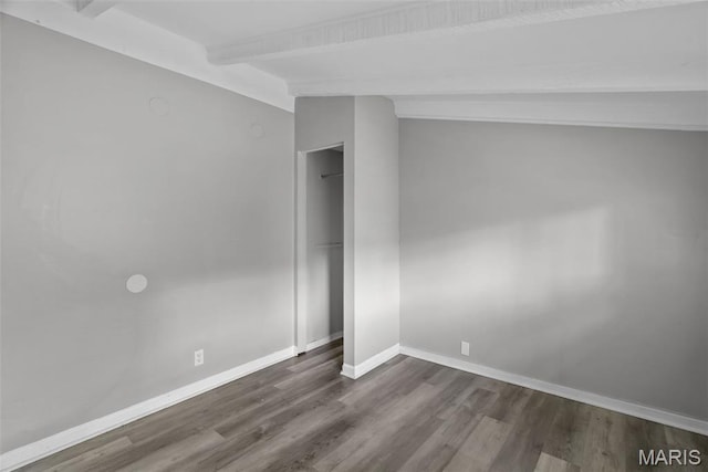 2826 Dawnview Dr, Florissant, MO 63031 - empty room with beam ceiling and dark wood-type flooring