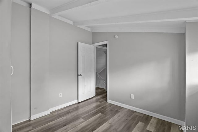 2826 Dawnview Dr, Florissant, MO 63031 - unfurnished bedroom featuring beamed ceiling and wood finished floors