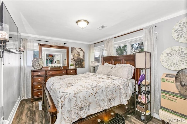 8400 Chalons Ct, Berkeley, MO 63134 - bedroom with dark wood-style floors and baseboards