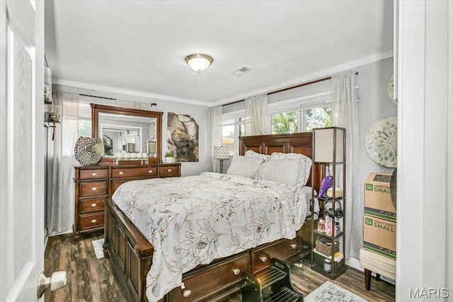 8400 Chalons Ct, Berkeley, MO 63134 - bedroom featuring dark wood finished floors and crown molding