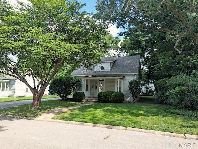 515 E S Ave, Greenville, IL 62246 - view of front of property with a front lawn, roof with shingles, and a porch