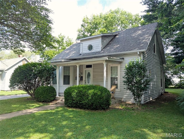 515 E S Ave, Greenville, IL 62246 - view of front of property with a front lawn, a porch, and roof with shingles