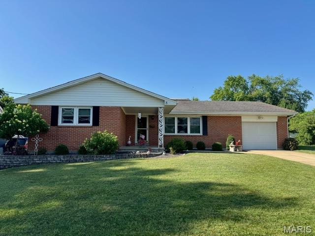 8 E 11th St, Washington, MO 63090 - ranch-style house featuring a front yard, concrete driveway, brick siding, and an attached garage