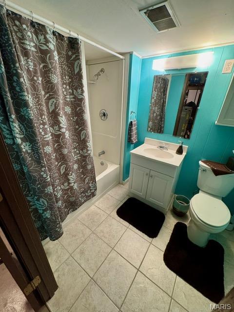 8 E 11th St, Washington, MO 63090 - full bathroom with tile patterned floors, vanity, and shower / bath combo with shower curtain