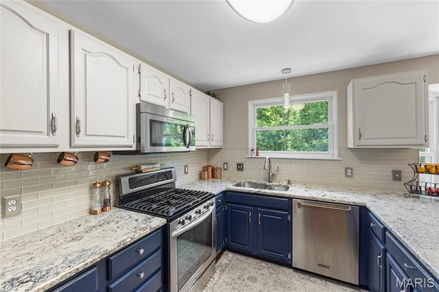 600 Emerald Meadows Ct, Saint Charles, MO 63304 - kitchen with stainless steel appliances, blue cabinets, and white cabinetry