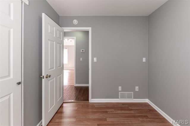 1409 Castle Mill Dr, Arnold, MO 63010 - empty room featuring wood finished floors and a smoke detector