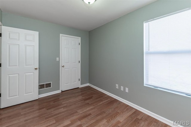1409 Castle Mill Dr, Arnold, MO 63010 - unfurnished room with wood finished floors and baseboards