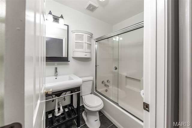 1409 Castle Mill Dr, Arnold, MO 63010 - full bathroom with bath / shower combo with glass door, tile patterned flooring, and vanity