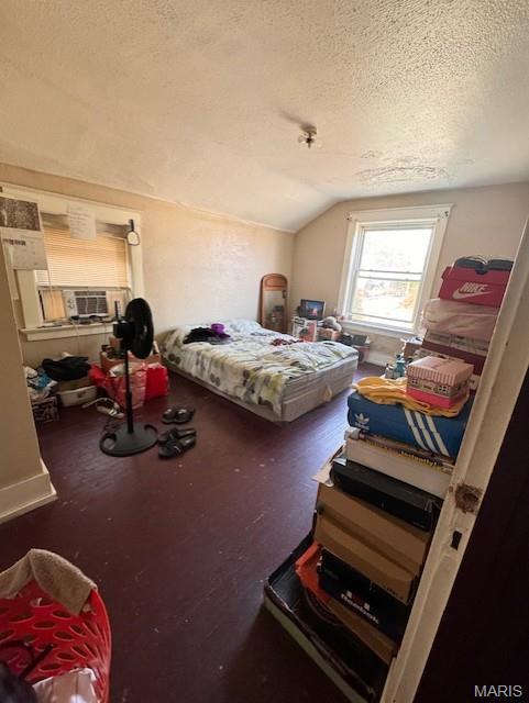 4202 Gano Ave, Saint Louis, MO 63107 - bedroom with a textured ceiling and vaulted ceiling