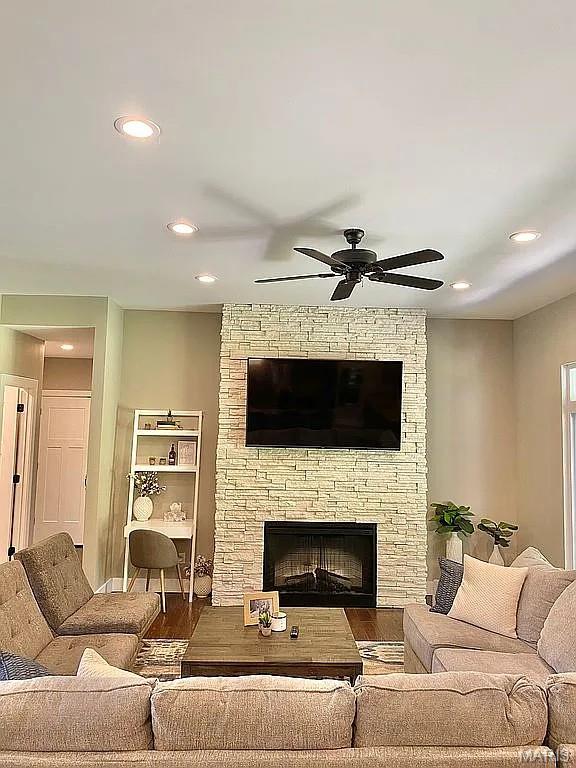 1106 Palmer Pl, Imperial, MO 63052 - living area featuring recessed lighting, ceiling fan, wood finished floors, and a stone fireplace