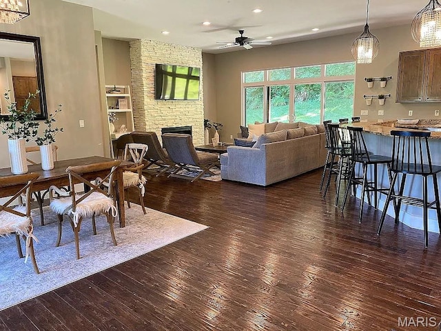 1106 Palmer Pl, Imperial, MO 63052 - dining room with ceiling fan, dark wood-style flooring, a fireplace, and recessed lighting