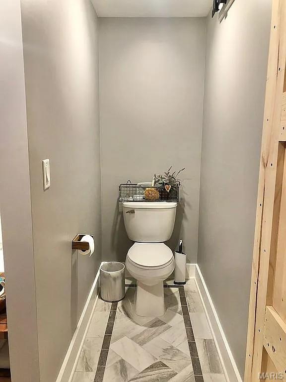 1106 Palmer Pl, Imperial, MO 63052 - bathroom with toilet and marble finish floors