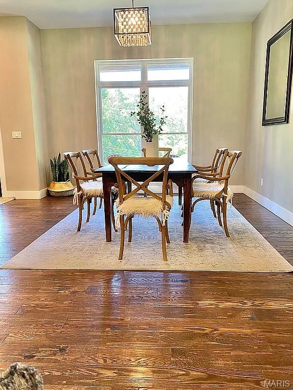 1106 Palmer Pl, Imperial, MO 63052 - dining space featuring dark wood-style flooring and a chandelier