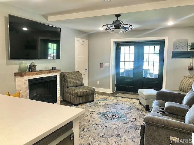 1106 Palmer Pl, Imperial, MO 63052 - living room featuring wood finished floors, recessed lighting, a brick fireplace, and a ceiling fan