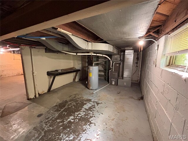 6765 Kenwood Dr, Northwoods, MO 63121 - below grade area featuring gas water heater and heating unit