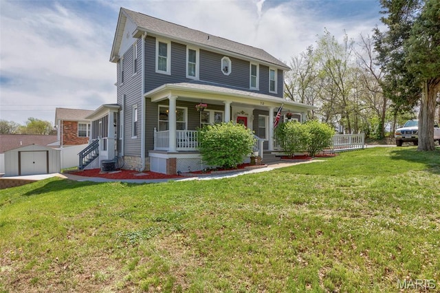 712 Maple St, Hillsboro, MO 63050 - view of front facade with covered porch, a front yard, an outbuilding, and a garage
